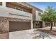 Contemporary two-story home featuring a two-car garage and stone accents at 2000 N 36Th St # 30, Phoenix, AZ 85008
