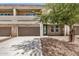 Contemporary home exterior featuring a two-car garage and manicured landscaping at 2000 N 36Th St # 30, Phoenix, AZ 85008