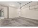 Spacious garage features concrete floors, water heater, and automatic door at 2000 N 36Th St # 30, Phoenix, AZ 85008