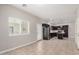 View of kitchen with stainless appliances, dark cabinets from an open area of the home at 2000 N 36Th St # 30, Phoenix, AZ 85008