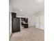 Open-concept living space features tile flooring and a modern kitchen at 2000 N 36Th St # 30, Phoenix, AZ 85008