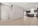 Open-concept living area with tile flooring connects to the staircase and kitchen at 2000 N 36Th St # 30, Phoenix, AZ 85008