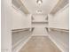 A spacious walk-in closet with rods and shelves at 2000 N 36Th St # 30, Phoenix, AZ 85008
