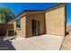View of backyard with a concrete patio and AC unit at 23682 W Bowker St, Buckeye, AZ 85326