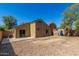Image of a backyard, displaying the home's architectural details and outdoor space for gardening at 23682 W Bowker St, Buckeye, AZ 85326
