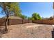 This backyard features a perimeter wall with landscaping and space for creativity at 23682 W Bowker St, Buckeye, AZ 85326