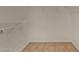 A small walk in closet with white walls, and wire shelving at 23682 W Bowker St, Buckeye, AZ 85326