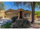 Charming one-story home featuring a 2-car garage and meticulously maintained front yard landscaping at 23682 W Bowker St, Buckeye, AZ 85326