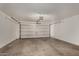 Spacious garage with a functional garage door and ample room for vehicle storage at 23682 W Bowker St, Buckeye, AZ 85326