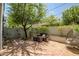 Inviting backyard featuring a brick-paved patio and comfortable seating, set against a backdrop of mature landscaping at 240 W Missouri Ave # 1, Phoenix, AZ 85013