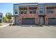 Charming townhome featuring brick accents, private garages, and well-maintained landscaping at 240 W Missouri Ave # 1, Phoenix, AZ 85013