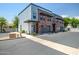 Modern townhome exterior boasts brick accents, private garages, and sleek architectural details at 240 W Missouri Ave # 1, Phoenix, AZ 85013