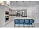 Bright, open kitchen features stainless appliances, sleek island with barstool seating, and modern design at 240 W Missouri Ave # 1, Phoenix, AZ 85013