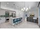 Open floor plan showcases modern kitchen, and living space with a large couch at 240 W Missouri Ave # 1, Phoenix, AZ 85013