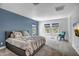 Spacious main bedroom with accent wall and ample natural light from large windows at 240 W Missouri Ave # 1, Phoenix, AZ 85013