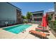 Relaxing pool area with lounge chairs, vibrant umbrellas and secure fencing for leisurely afternoons at 240 W Missouri Ave # 1, Phoenix, AZ 85013