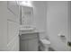 Well-lit powder room features a unique sink, neutral decor, and modern fixtures at 240 W Missouri Ave # 1, Phoenix, AZ 85013