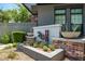 Landscaped entrance with modern address marker and manicured greenery enhances curb appeal at 240 W Missouri Ave # 1, Phoenix, AZ 85013