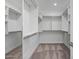 Spacious walk-in closet with extensive shelving and ample storage space for an organized wardrobe at 240 W Missouri Ave # 1, Phoenix, AZ 85013