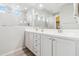 Elegant bathroom with a double sink vanity, granite countertops, and modern fixtures at 25876 N 162Nd Dr, Surprise, AZ 85387