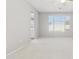 Bright and spacious bedroom featuring neutral tones and a window with views of the outside at 25876 N 162Nd Dr, Surprise, AZ 85387