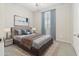 A lovely bedroom features a comfortable bed, stylish decor, and plenty of natural light at 25876 N 162Nd Dr, Surprise, AZ 85387