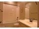 Bathroom features a tub, toilet, sink, and a decorative painting hung on the wall at 2811 S Jeffry St, Gilbert, AZ 85295