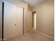 Bedroom features a spacious closet with sliding doors and neutral carpeting at 2811 S Jeffry St, Gilbert, AZ 85295