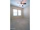 Bedroom with ceiling fan, neutral carpeting and light-filled windows at 2811 S Jeffry St, Gilbert, AZ 85295