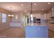 Open concept kitchen with granite countertops, stainless steel appliances, and tile floors at 2811 S Jeffry St, Gilbert, AZ 85295