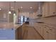 Beautiful kitchen featuring white cabinets, stainless steel appliances, and an island with granite countertops at 2811 S Jeffry St, Gilbert, AZ 85295