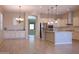 Bright kitchen with white cabinetry, granite countertops, stainless steel appliances, and wood-look tile flooring at 2811 S Jeffry St, Gilbert, AZ 85295