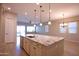 Granite kitchen island with sink, stainless steel appliances, and tile floors at 2811 S Jeffry St, Gilbert, AZ 85295