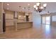 Spacious living area featuring wood-look tile flooring, recessed lighting, and an open-concept layout at 2811 S Jeffry St, Gilbert, AZ 85295