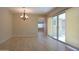 Open living space featuring recessed lighting, wood-look tile floors, and a large glass slider at 2811 S Jeffry St, Gilbert, AZ 85295