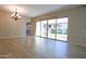 Bright living space featuring sliding glass doors to the outside and wood-look tile flooring at 2811 S Jeffry St, Gilbert, AZ 85295