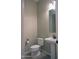 Powder room features a pedestal sink, toilet and tile flooring at 2811 S Jeffry St, Gilbert, AZ 85295