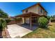 Inviting backyard with covered patio, lush greenery, and ample space for outdoor relaxation and entertainment at 3705 W Villa Theresa Dr, Glendale, AZ 85308