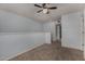 Spacious bedroom featuring a ceiling fan and neutral carpet at 3705 W Villa Theresa Dr, Glendale, AZ 85308
