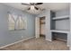 Carpeted bedroom with a ceiling fan, a window with blinds, and a closet at 3705 W Villa Theresa Dr, Glendale, AZ 85308