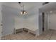Charming dining area with a built-in corner bench and chandelier lighting at 3705 W Villa Theresa Dr, Glendale, AZ 85308