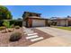 Charming home featuring a brick-accented garage, long driveway, and welcoming walkway at 3705 W Villa Theresa Dr, Glendale, AZ 85308
