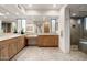 Luxurious bathroom with dual vanity, granite countertops, and glass enclosed shower at 39089 N 102Nd Way, Scottsdale, AZ 85262