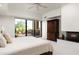 Primary bedroom featuring a fireplace, outside access and ensuite bath at 39089 N 102Nd Way, Scottsdale, AZ 85262