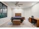 Spacious bedroom featuring a ceiling fan and a view of the side yard at 39089 N 102Nd Way, Scottsdale, AZ 85262