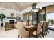 Elegant dining room features a chandelier, and expansive glass doors with pool views at 39089 N 102Nd Way, Scottsdale, AZ 85262