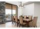 Dining area with elegant furnishings, a chandelier, and a view to the backyard at 39089 N 102Nd Way, Scottsdale, AZ 85262