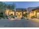 Inviting front entrance with stone accents and desert landscaping creating striking curb appeal at 39089 N 102Nd Way, Scottsdale, AZ 85262