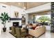 Spacious living room with a fireplace, recessed lighting, and walls of windows at 39089 N 102Nd Way, Scottsdale, AZ 85262