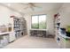 Bright office space featuring custom shelving and a large window with scenic views at 39089 N 102Nd Way, Scottsdale, AZ 85262